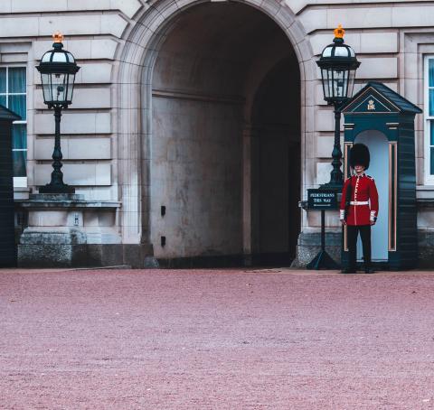 Guard standing by a gate