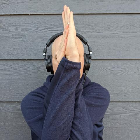 Matthew with eagle arms and headphones