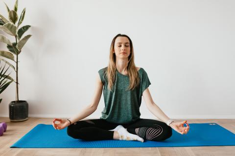 Peaceful lady sitting in meditation