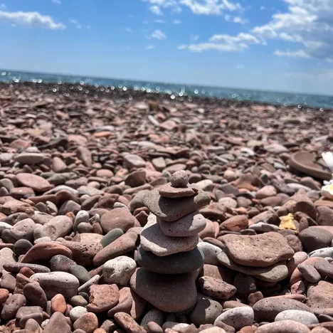 rocks on the shore with lake superior in the background