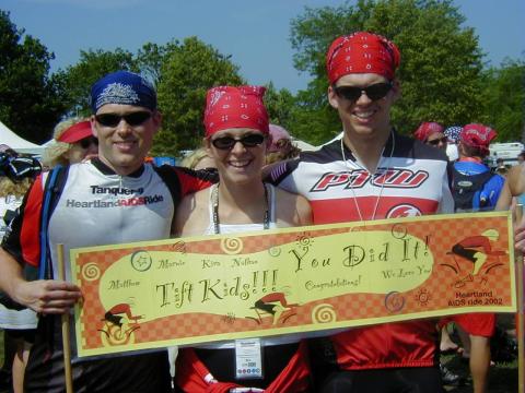 Matthew, Kira, and Nathan in bike clothing at 2002 Heartland AIDS Ride